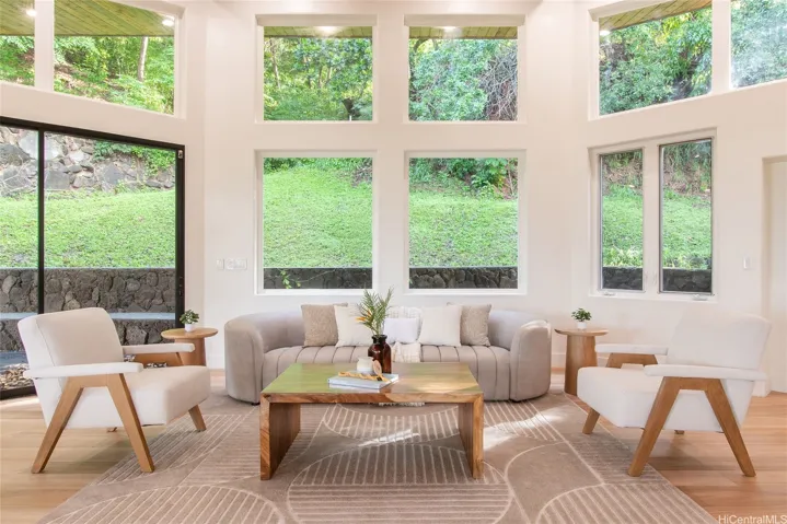 These windows and sliding glass doors make this home feel truly immersed into the jungle