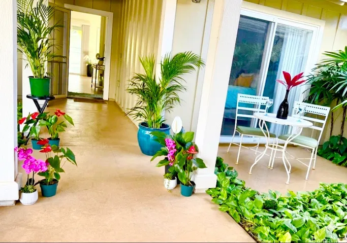 Front of the home with a cozy lanai fronting the 1st bedroom. Bottom floor with open concept interior.