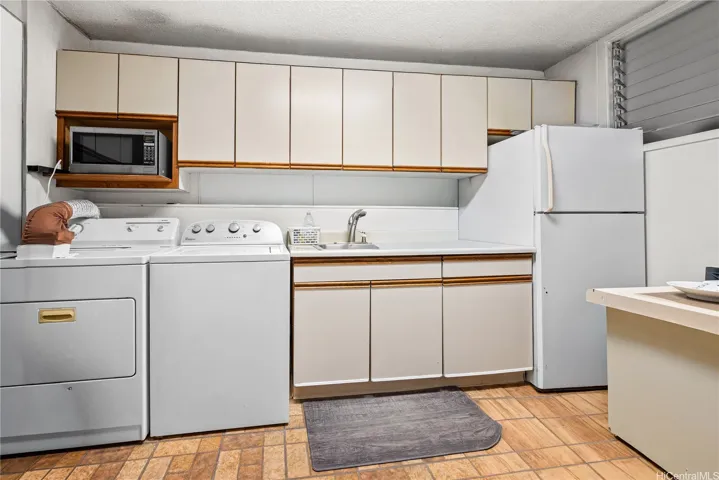 Enhanced Photo.  Refrigerator pictured is included in the sale of this unit.