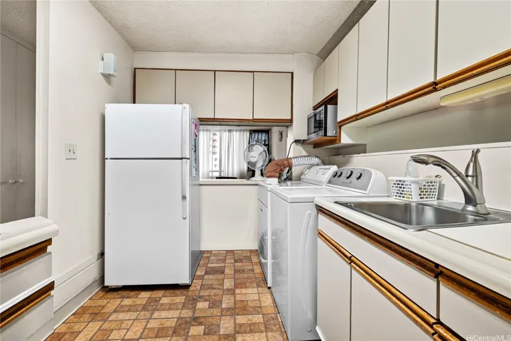 Large kitchen fits 2 refrigerators.  Only 1 is included in the sale of this unit.  Enhanced photo.