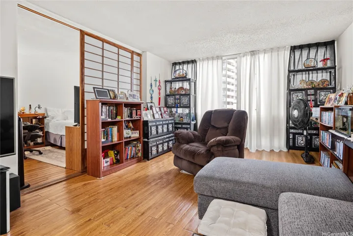 Spacious living area with shoji room divider that leads to the 2nd bedroom.