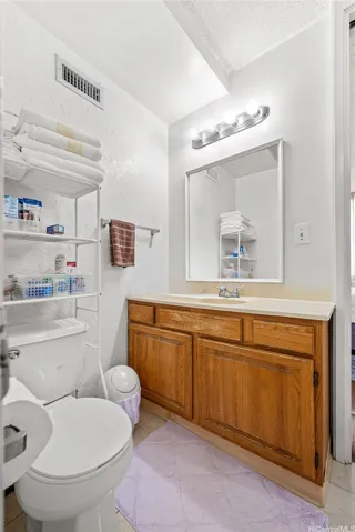 2nd Vanity and toilet off the 2nd bedroom.