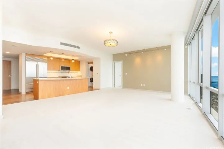 LIVING ROOM LOOKING TO KITCHEN WITH LAUNDRY ROOM ON RIGHT SIDE