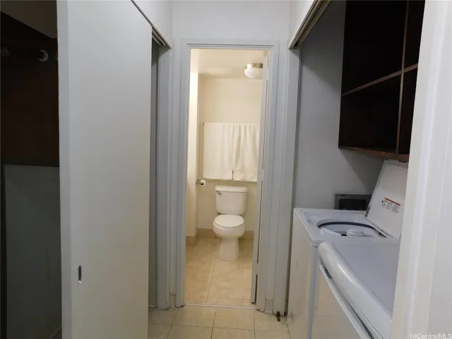 Second closet in the dressing area, across from the full-size washer and dryer.