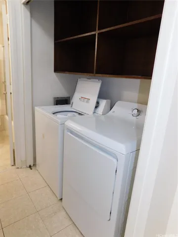 Full-size washer and dryer, with more shelving.