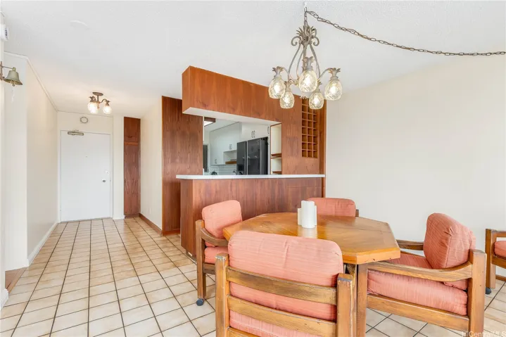 large entryway and kitchen open to dining area