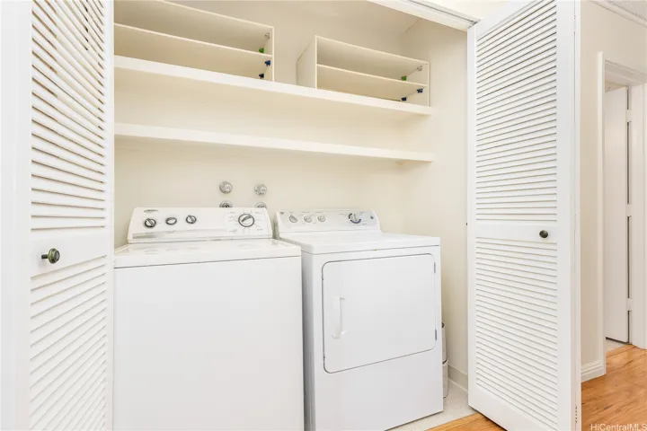 full size washer and dryer located in upstairs hallway