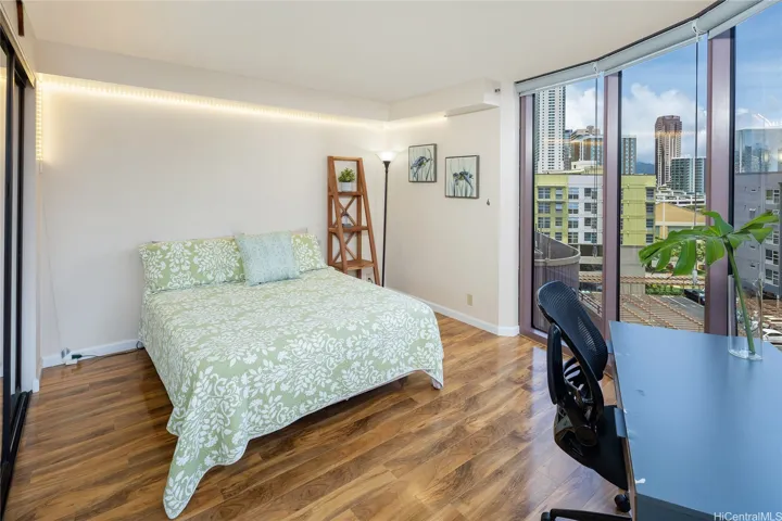 Second bedroom also enjoys floor to ceiling windows with a large foot print. Enhanced photo.