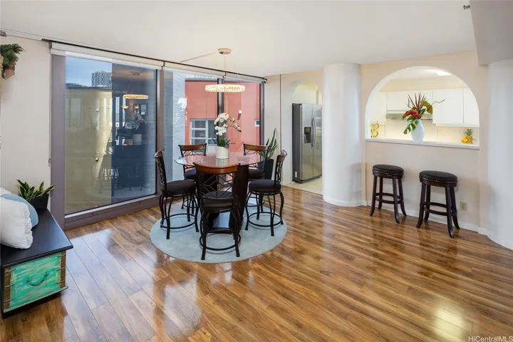 The dining room, large enough for a 12 person dining table with tons of natural light flooding in. Enhanced photo.
