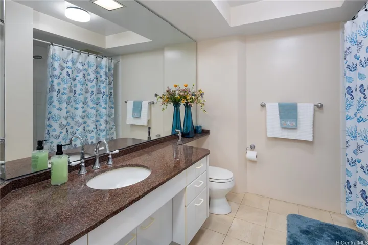 Second/hallway bathroom with stackable washer and dryer.