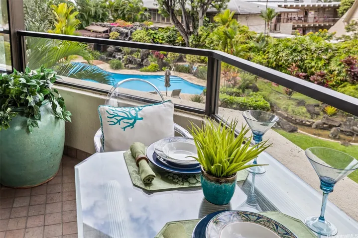 Enjoy dining on the covered lanai with this most sought after view of the lagoon pool, spa, and garden.