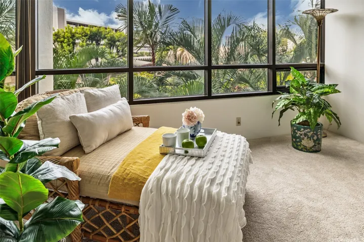 Nice little lounging area with gorgeous greenery view from the Primary bedroom.