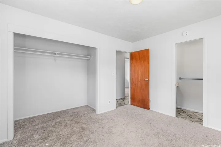 Primary bedroom with half bath