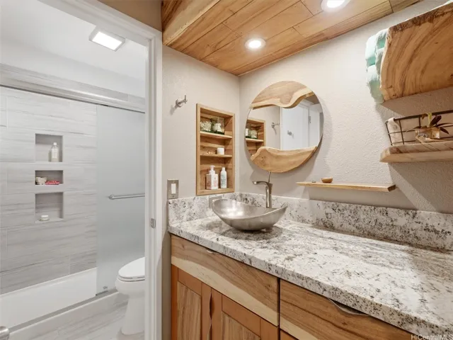 Bathroom on main floor with Monkeypod wood accents