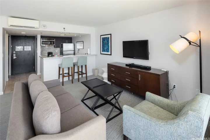 Living room is adjacent to the kitchen
