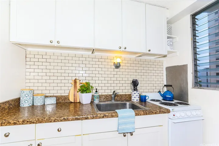 Kitchen lighting and lots of storage for a small studio.