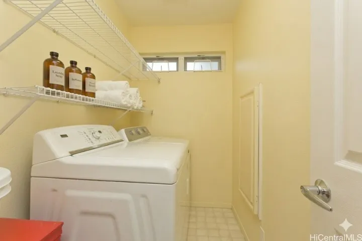Indoor laundry, adjacent to the garage.