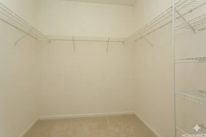 Primary walk in closet.