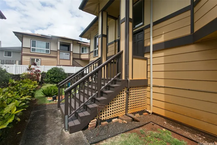 The wonderful entry on the side of the home is covered and has gorgeous double doors into a cozy entryway.