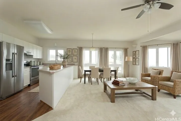 **virtually staged** The open concept second floor has a gorgeous layout with plenty of space for dining and living as you look out the windows to spectacular ocean views.