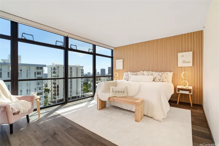 Bright main bedroom with accent wall, picturqest windows & roller blinds.