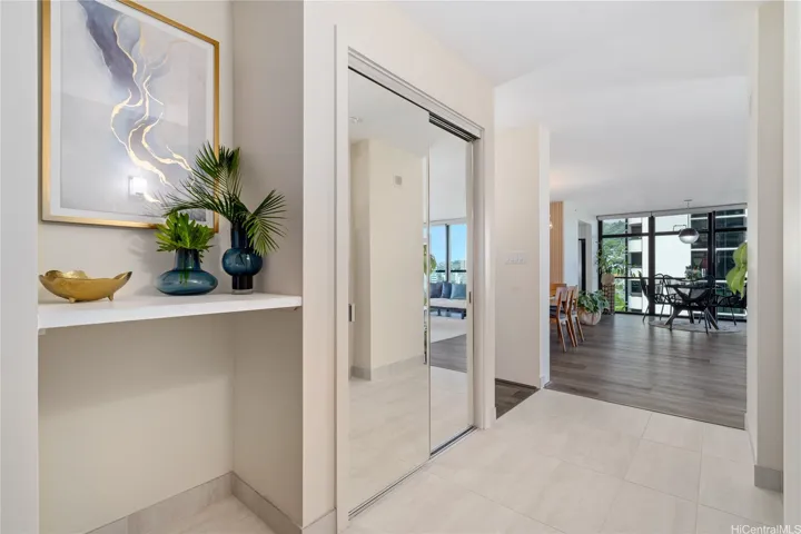 Gracious entry to greet you. Convenient mirrored closet to store shoes & bags.