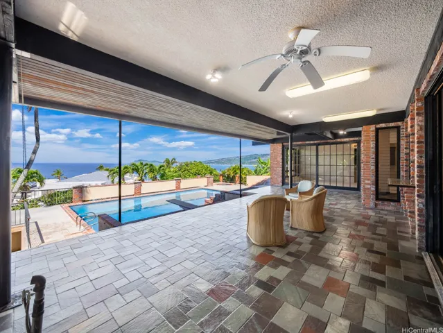 Ground floor covered lanai with lots of deck space and heated pool is ideal for entertaining.