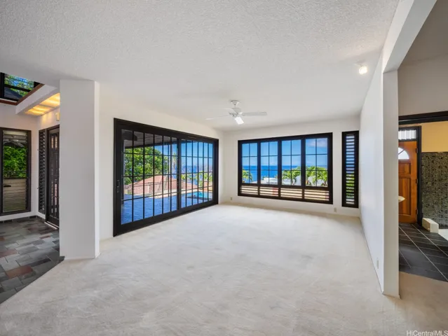 The Living Room on the ground floor and features large custom doors which open up creating an expansive indoor outdoor living space.