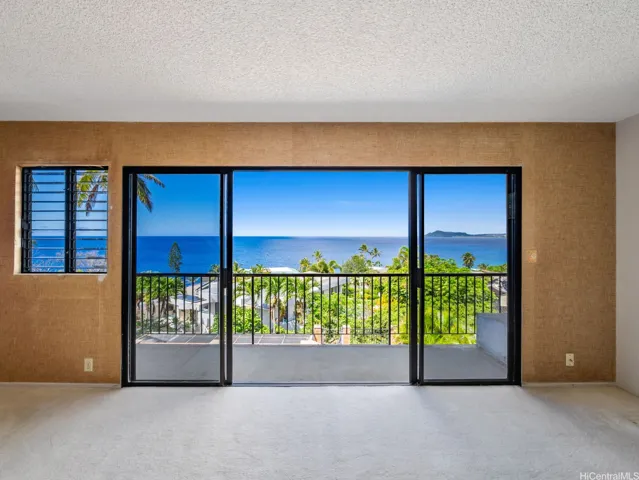 The Primary Suite delivers ocean views, a large bathroom, walk-in closet and a wraparound covered lanai.