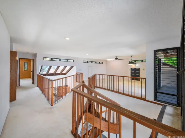 The second floor features the Primary Suite, a large bedroom, 2 bathrooms and this large open office or additional living room area.