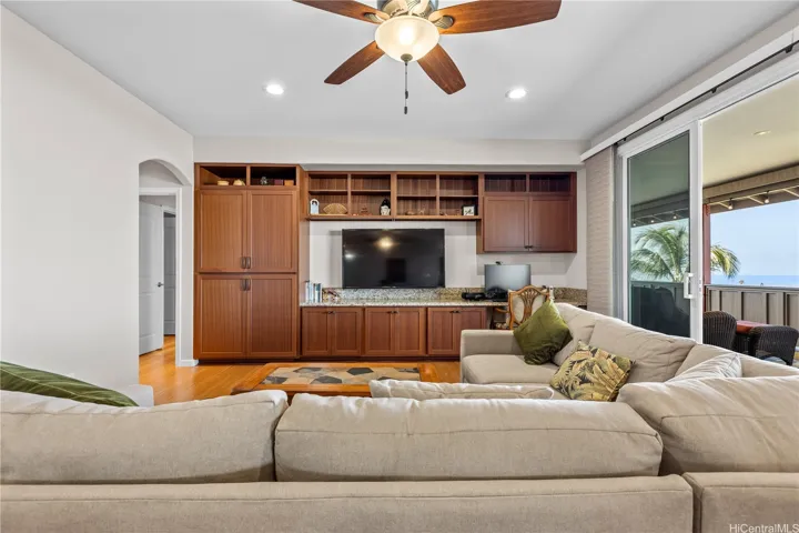 Large relaxing living room with ocean views and large sliding doors to enjoythe breezes.