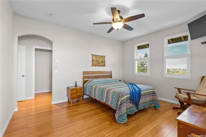 Primary bedroom off the lanai takes advantage of ocean views and lanai entrance
