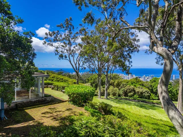 A unique, historic Tantalus Estate featuring a stately drive, expansive lawns and panoramic views from Diamond Head to Haleiwa!