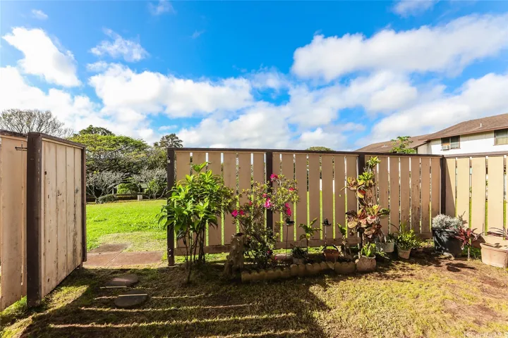 Private fenced yard in back, leads to a nice large back field to enjoy.