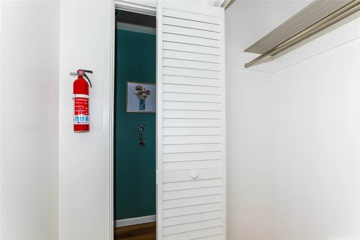 Hall storage closet and convenient half bath near kitchen
