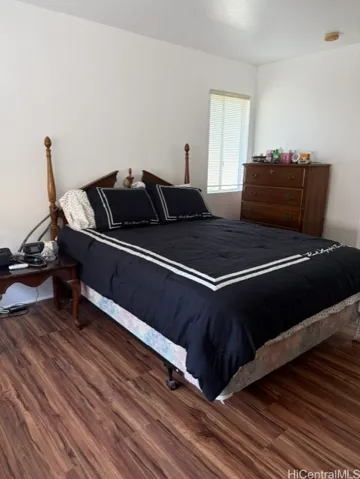 The primary bedroom with luxury vinyl floor.