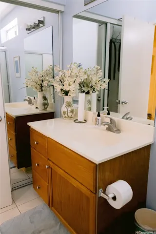 The vanity & mirror door of cabinet on  2nd bathroom.