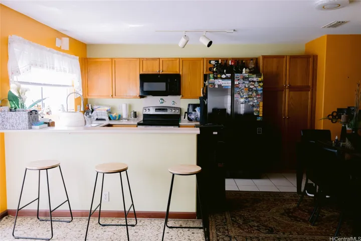 Open layout of the kitchen and the living room.