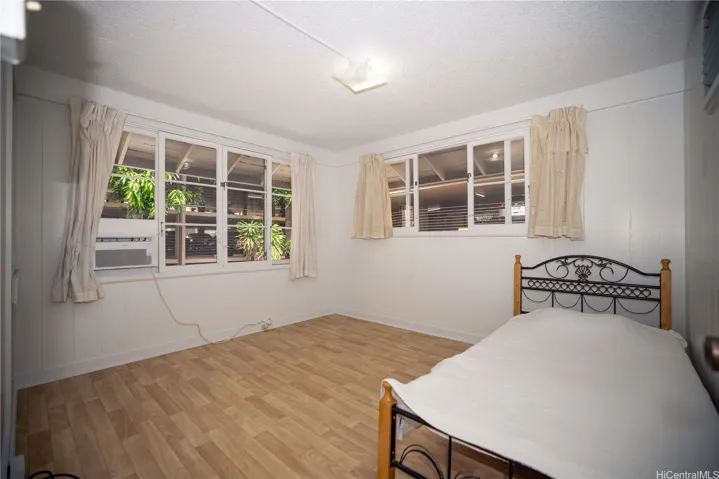 peaceful bedroom also has extra window