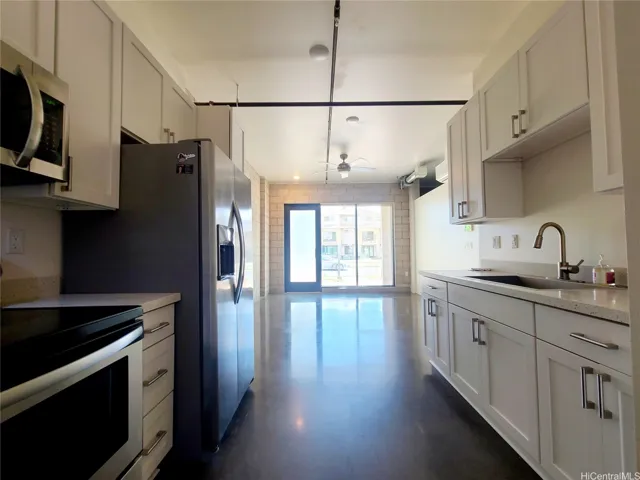 Kitchen with beautiful cabinets & counter & stainless steel appliance