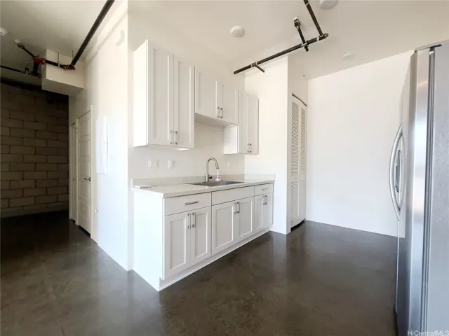 Kitchen with beautiful cabinets & counter & stainless steel appliances