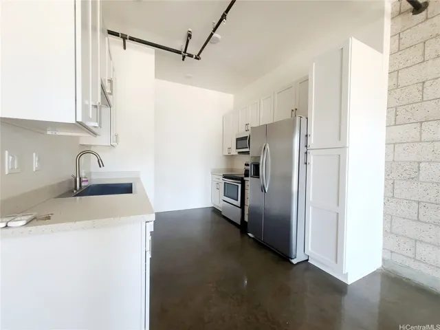Kitchen with beautiful cabinets & counter & stainless steel appliances