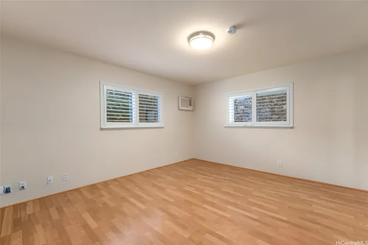 One of three bedrooms in lower level. Laminate flooring with window a/c.