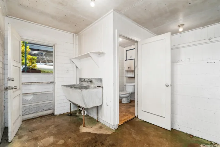 Lower level side door access to the laundry room and bathroom.