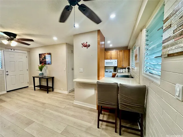 The wrap around kitchen counter is functional and spacious.