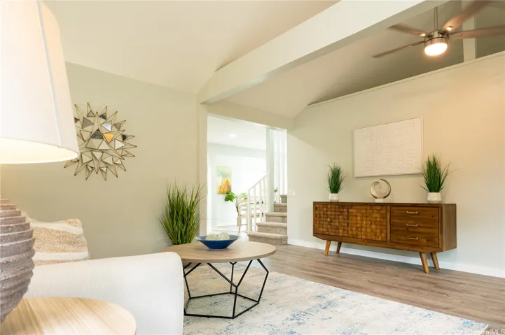The living room opens into the kitchen and dining areas.