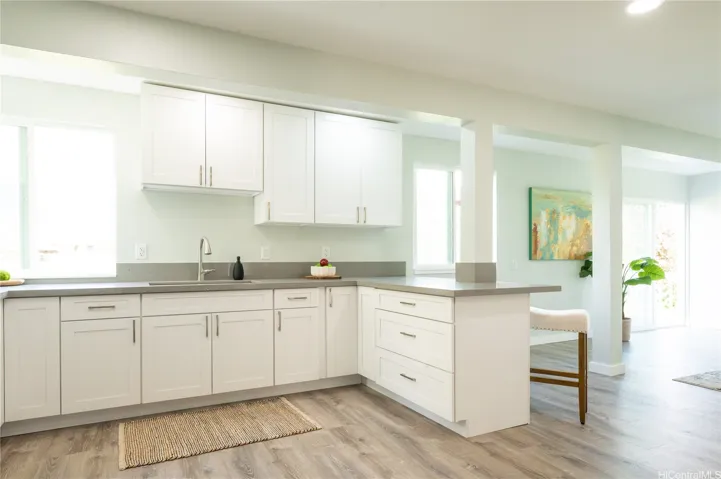 The living room opens into the dining room with mountain views from the windows and doorwall.