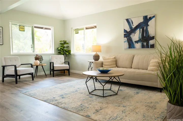 Natural light pools into the living room, while flush mount ceiling light illuminates the space at night.