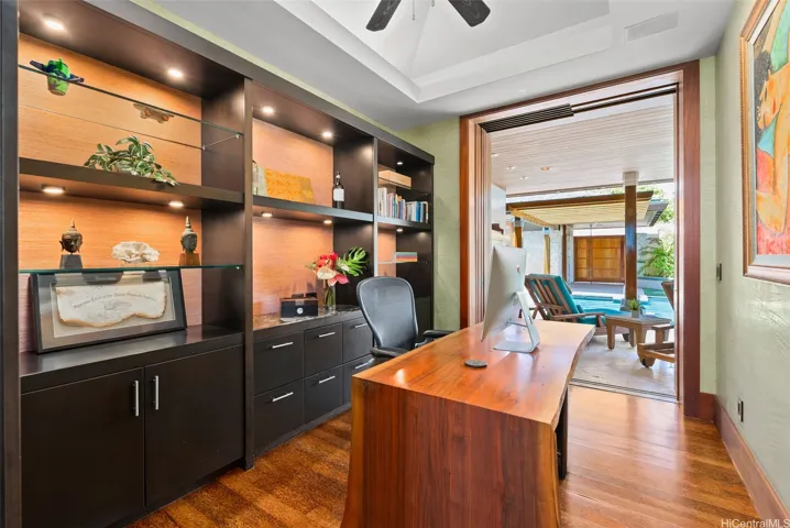 A separate office is located next to the primary suite and opens onto the pool courtyard.