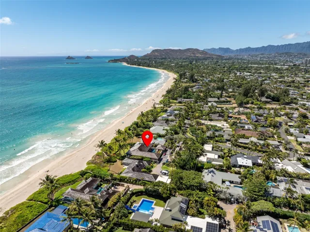 Located steps from the white sands of 3 mile long beach.